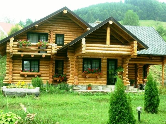 Proiectele de case din lemn rotund